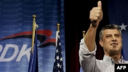 Kosovo Prime Minister Hashim Thaci gives a thumbs up as he claims victory for his Democratic Party of Kosovo (PDK) in Pristina late on November 15.