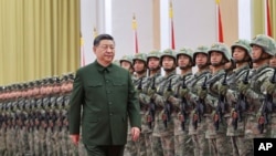 Președintele chinez Xi Jinping trece în revistă trupele în timpul unei inspecții la o garnizoană a Armatei din Macao, în sudul Chinei. Decembrie 2024. Fotografie de arhivă.