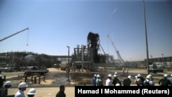 Novinari tokom posete pogođenim naftnim postrojenjima u Saudijskoj Arabiji, 20. septembar 2019. 