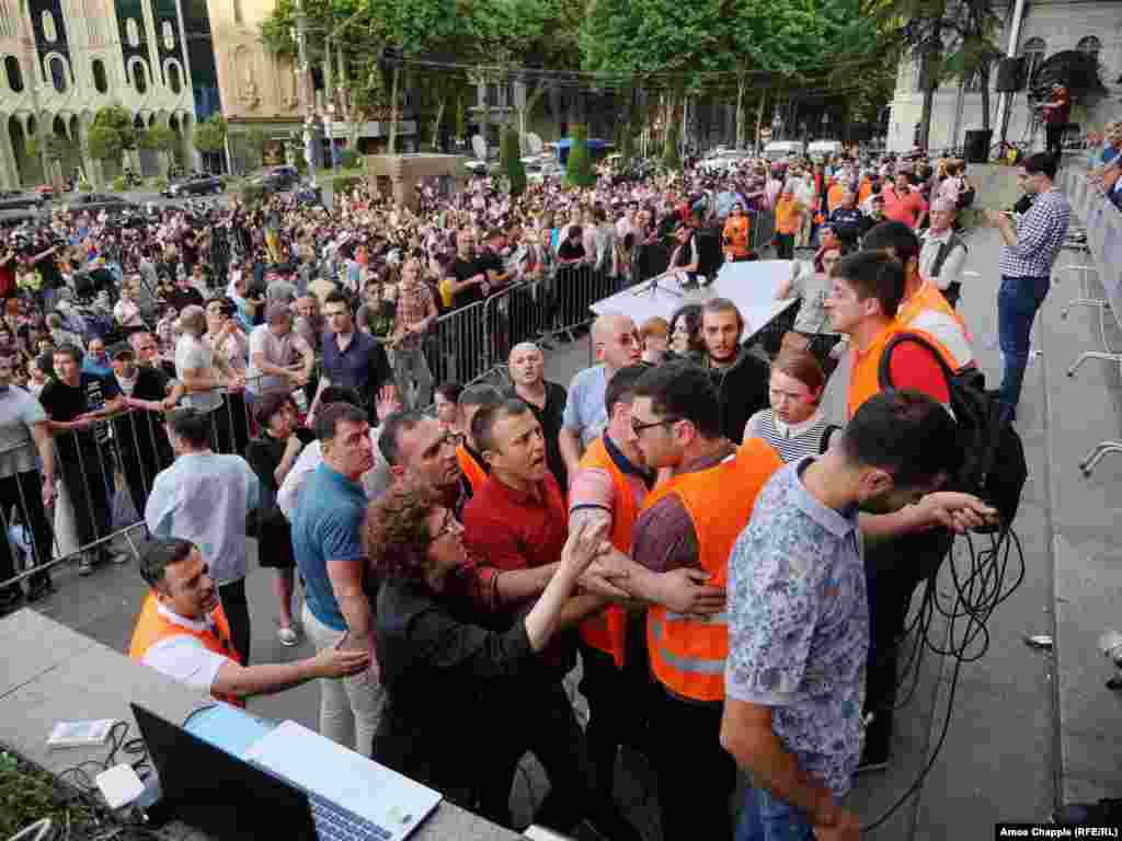 Arguments broke out while opposition politicians apparently tried to gain access the stage and address the protesters. The appearance by Gavrilov in parliament on June 20 drew strong reactions from opposition members, student activists, and others as thousands turned out to demonstrate. Georgia's parliamentary speaker, Irakli Kobakhidze, resigned after the incident.