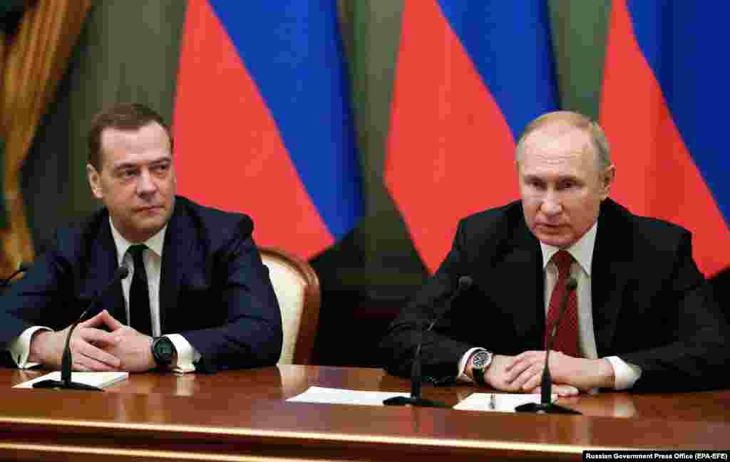 Putin and Medvedev meet with members of the government in Moscow on January 15, 2020. Putin used his annual state-of-the-nation speech to call for a referendum on substantial constitutional amendments that would strengthen parliament's powers before his term ends in 2024. Hours later, Medvedev and his cabinet resigned.