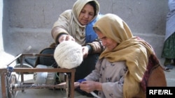 Afghan women begin weaving a carpet in Kabul. Some entrepreneurs have built on traditionally female trades to develop thriving businesses.