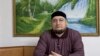 Russian Rights Activist Says His Home Surrounded