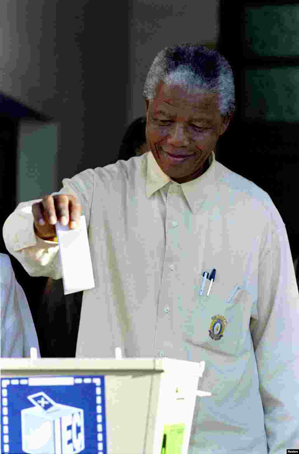 Nelson Mandela casts his ballot in South Africa's first multiracial elections in April 1994.