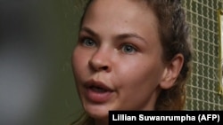 Anastasia Vashukevich arrives at a holding cell to face trial at a court in Pattaya on April 17.