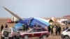 Спасатели и полиция у фрагмента рухнувшего самолета компании Azerbaijan Airlines. Мангистауская область, 26 декабря 2024 года 