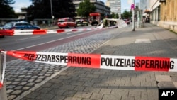 A police line is seen near the site where a Syrian asylum seeker killed a woman and injured two people with a machete in Reutlingen, southern Germany, on July 24.