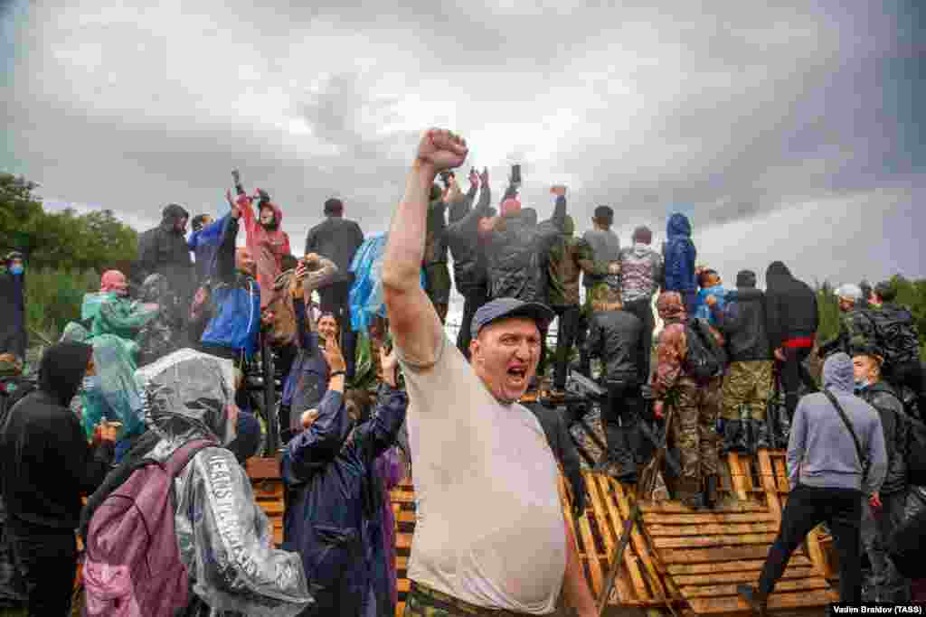 People take part in a protest against the Bashkir Soda Company's plans to use the area for limestone mining on August 16. Local residents started staging rallies on August 15 and drawing up online petitions to protect and preserve Kushtau as one of the four "shihans," the remains of ancient sea reefs, stretching along the Belaya River over 20 kilometers, holding paleontological value and inhabited by endangered species.