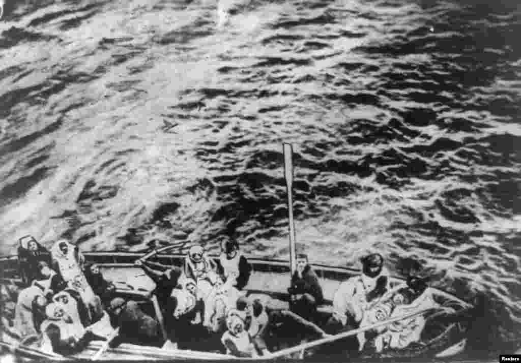 A lifeboat from the "Titanic" pulls alongside the "Carpathia" following the sinking on April 15, 1912.
