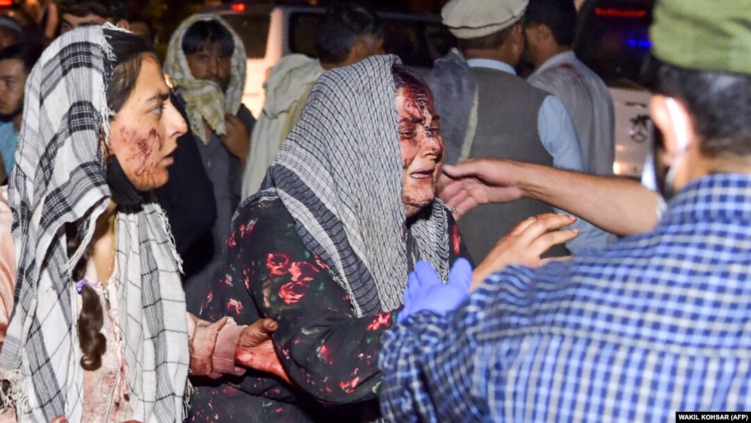 Afghan women at the scene of a rocket attack on Kabul Airport on August 26 that was claimed by the Islamic State.