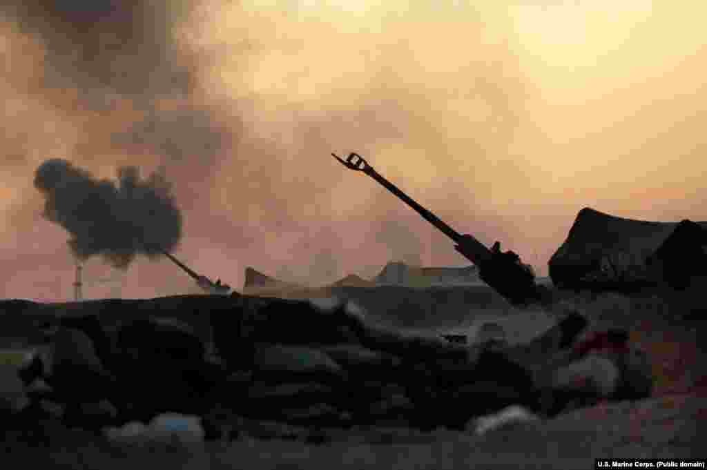U.S. Marine howitzers pummel an IS position during the four-month battle for Raqqa, the de facto "capital" of the Islamic State group until the city was liberated in October 2017. 