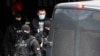 Policajci privode Veljka Belivuka tokom racije na stadionu Partizana u Beogradu, 4. februara 2021. 