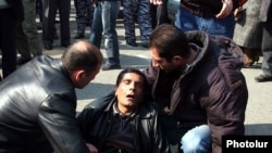 Ten people were killed and scores injured in the March violence.