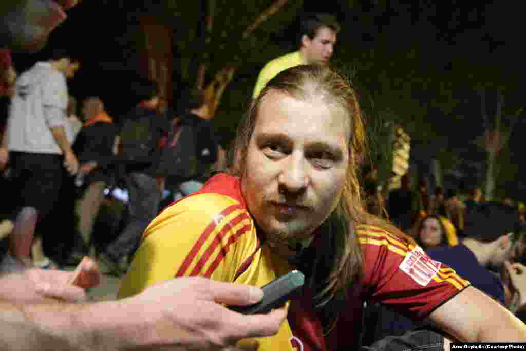 Namik Kemal Bora Gonulluleroglu wears the colors of the Galatasaray soccer team. "I have never seen this kind of thing," he says. "All the teams being united because of one main idea. We are losing our rights and there is no chance to even say this loudly."