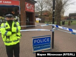 A British policeman guarding the area where former Russian spy Sergei Skripal and his daughter were found unconscious.