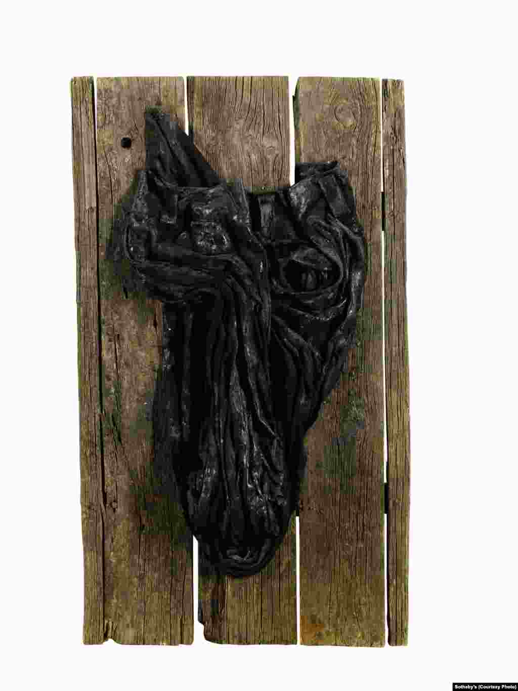 “Bull’s Head,” a 1976 work made of oil-soaked trousers mounted on wooden boards, by Georgian nonconformist artist Avto Varazi (1926-1977). Many of Varazi’s works focused on the theme of the bull’s head.