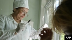 A doctor takes a blood test at the regional medical AIDS center in the southern Russian city of Rostov on Don. 