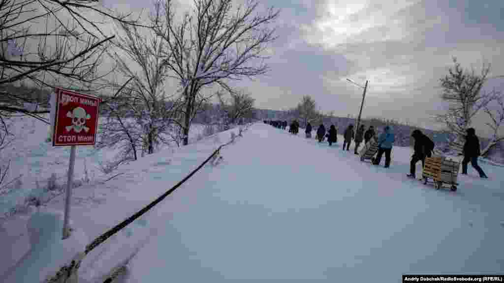 The farthest point our photographer walks before returning to government-held territory. A little farther on is a bridge that was destroyed by separatist forces in 2015. There appears to be little political will on either side to fix or replace the bridge.