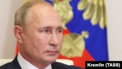 Russian President Vladimir Putin attends the traditional opening of the school year known as the Day of Knowledge, via videoconference from the Novo-Ogaryovo residence outside Moscow, on September 1.