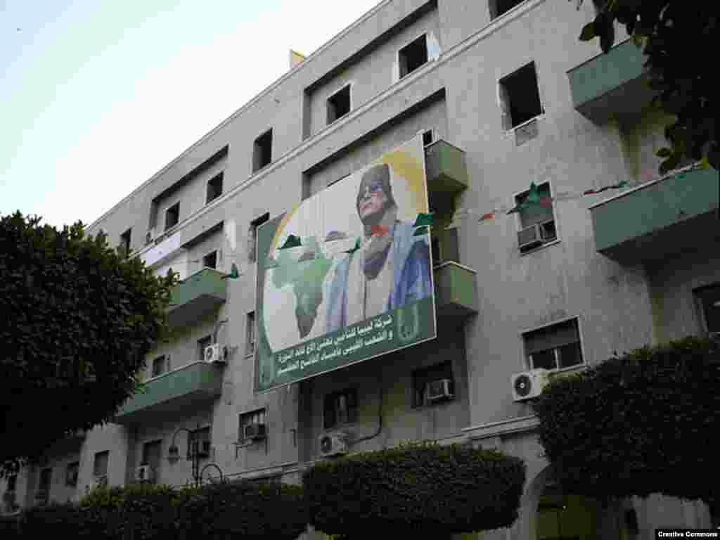 Qaddafi spent the 1990s and 2000s as a proponent of pan-Africanism. Apartment blocks, like these in Tripoli, are often adorned with homages to the leader. (Photo by Quigibo)