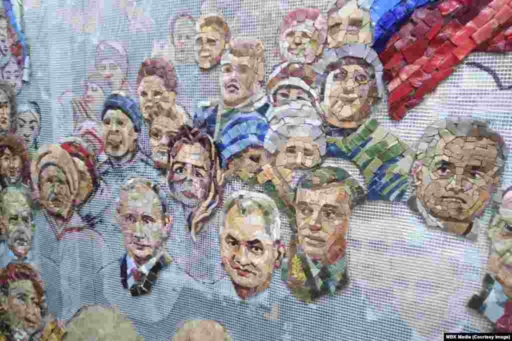 One of the leaked images showing work under way on a mosaic representing Putin, Shoigu, and other Russian politicians. Russian media later reported that the image of Putin was taken down. A Kremlin spokesman said that the Russian leader was aware of the mosaic but felt it was early to evaluate his work with such a depiction. 
