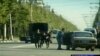 Russian police tend to a wounded officer during the fighting