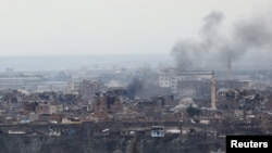 Smoke rises after clashes between Turkish security forces and Kurdish militants in the Sur district of Diyarbakir on February 11.