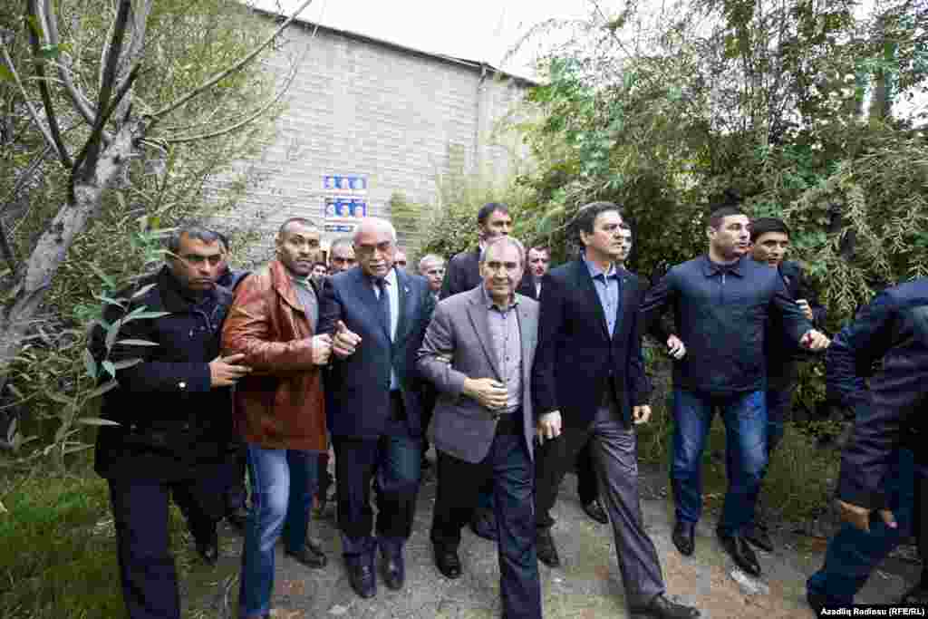 Hasanli (center) has used his campaign to criticize widespread corruption in the Aliyev government, and has actively sought to meet with supporters in Azerbaijan's smaller towns and regions. Here, Hasanli prepares for a speech in the city of Sumgait on October 6.