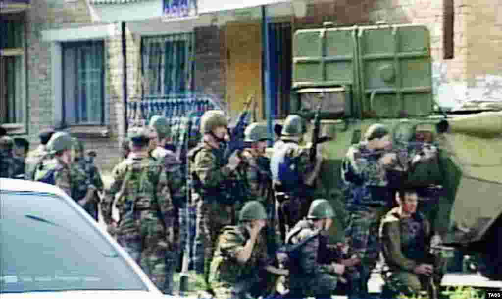 Russian troops gather outside Beslan's School No. 1.