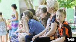Children and their parents who have fled to the Russian city of Rostov-na-Donu from eastern Ukraine.