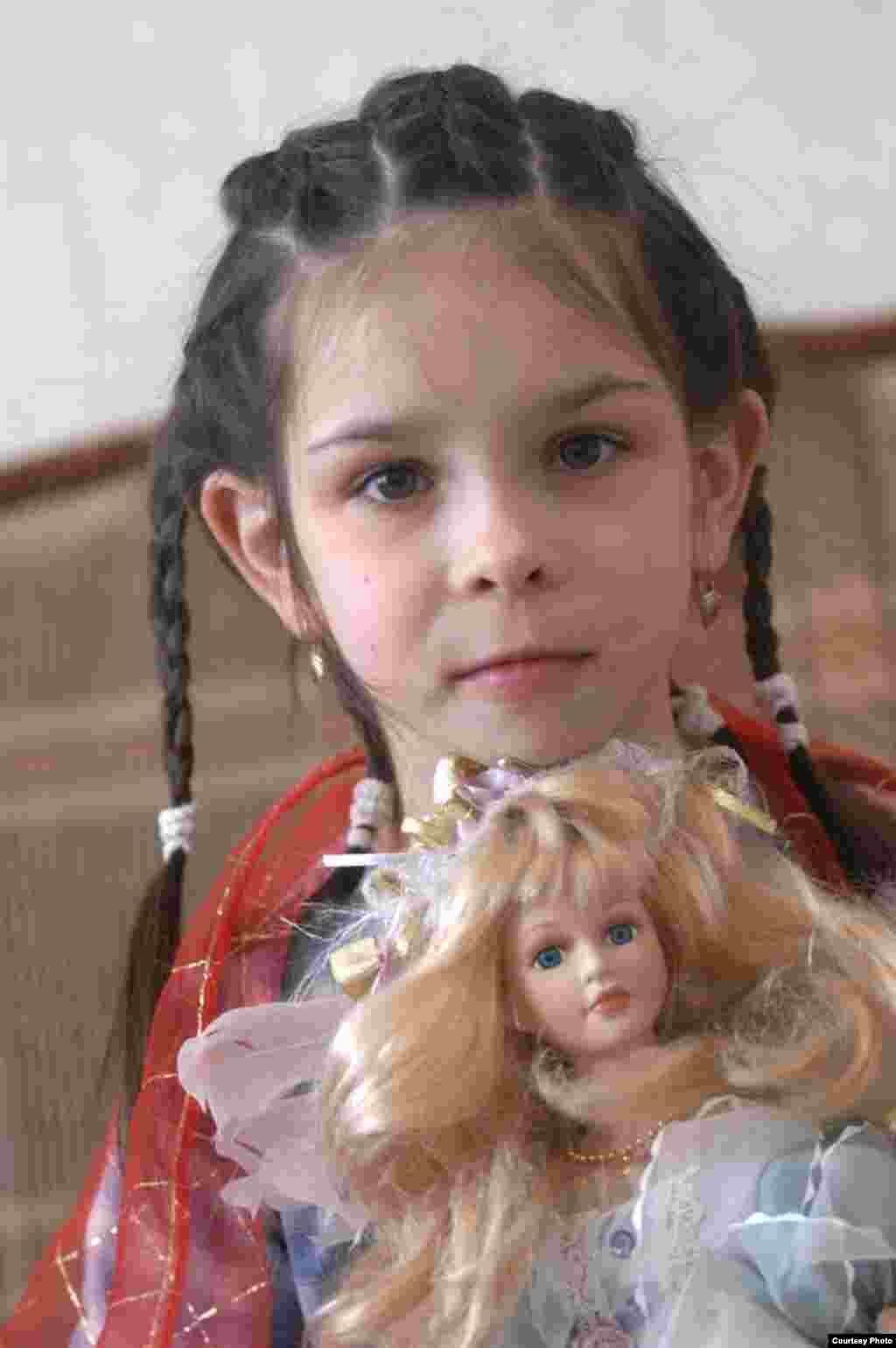 This girl was living in a special communal village for orphans in the northwestern city of Pushkin in 2005. The so-called "SOS" system, which seeks to create a normal family experience for parentless children, has been praised as one of the most progressive solutions for Russian orphans.