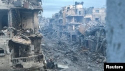 Urmările unui atac israelian în nordul Fâșiei Gaza.