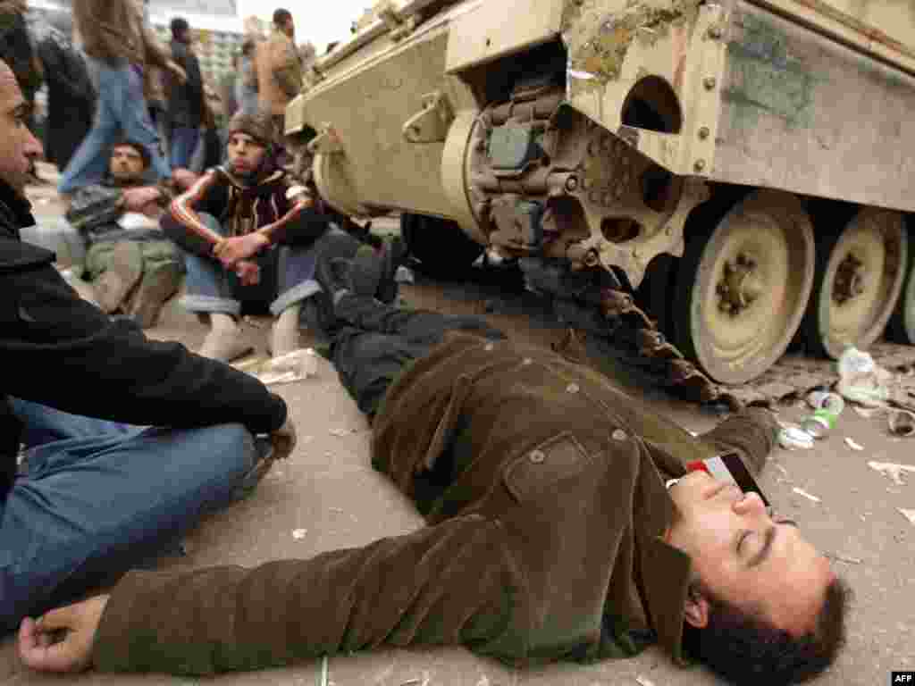 Protesters block one of the army's armored personnel carriers from pulling out of Tahrir Square on February 5.