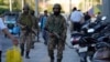 Indian paramilitary soldiers patrol as they guard at a busy market in Srinagar in Indian-administered Kashmir on April 29. 