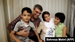 Nasrin Sotoudeh poses with her family at her house in Tehran in September 2013 after serving three years in prison.