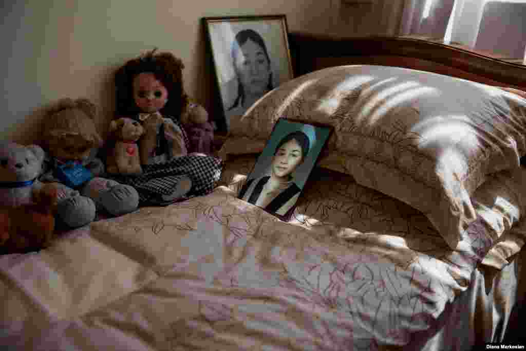 Time has stood still in Oksana Kokova's bedroom. Her father, Ruslan, likes to keep her door open. Oksana managed to escape after the explosions on the third day, but she returned to the school to help the younger children flee. She was killed in the process. Oksana was talented at sports, and loved karate and knitting. Living alone with her father and older brother, she had become accustomed to taking care of the house. She was friendly and talkative; she liked to take charge. Oksana was 15 years old. 