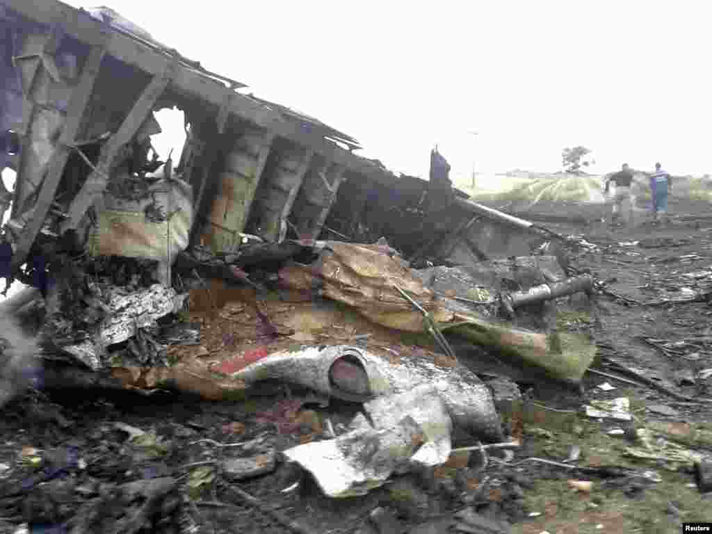 Twisted and burned wreckage of the Boeing 777 airliner. 