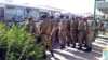 Солдаты у автобусной остановки в Туркменистане. Иллюстративное фото
