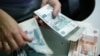 News Analysis: New Russia Sanctions Seen As Burning Slowly