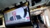 Ruski predsednik Vladimir Putin na ekranu u sali za medije u Beloj kući tokom TV prenosa potpisivanja nezavisnosti separatističkih regija na istoku Ukrajine, 21. februar 2022. 