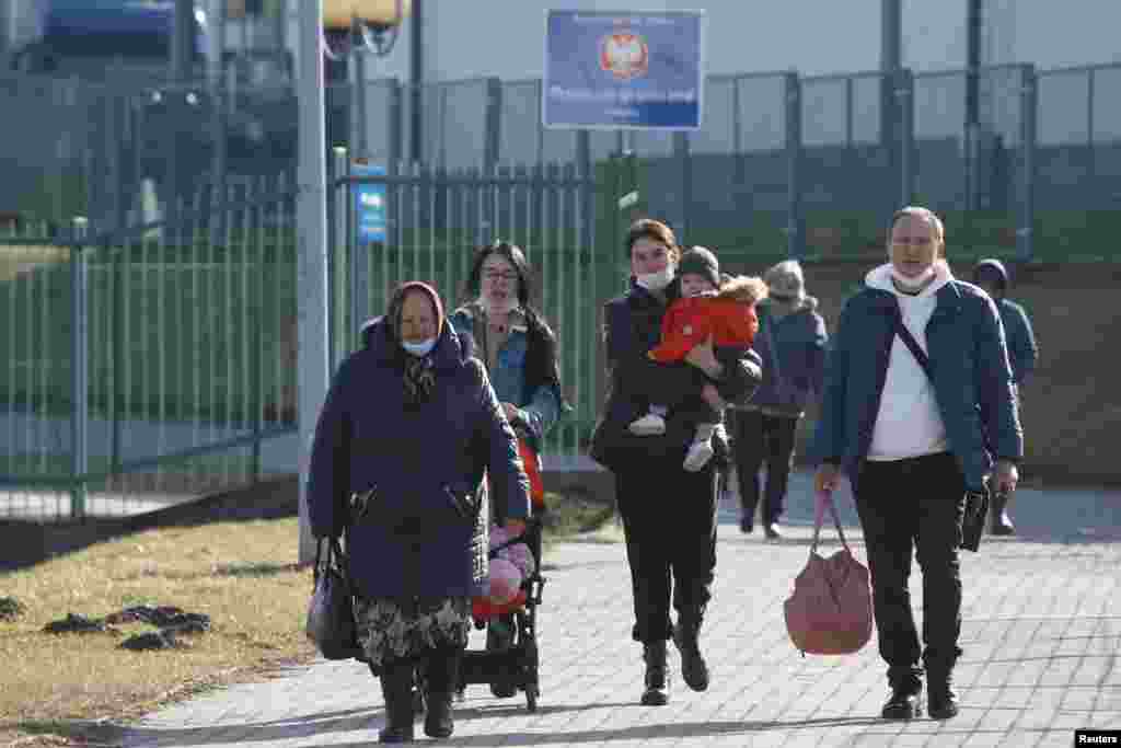 People walk at the border crossing between Poland and Ukraine in Medyka, Poland, on February 24.