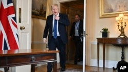 British Prime Minister Boris Johnson arrives to deliver an address in Downing Street about the situation in Ukraine on February 24.