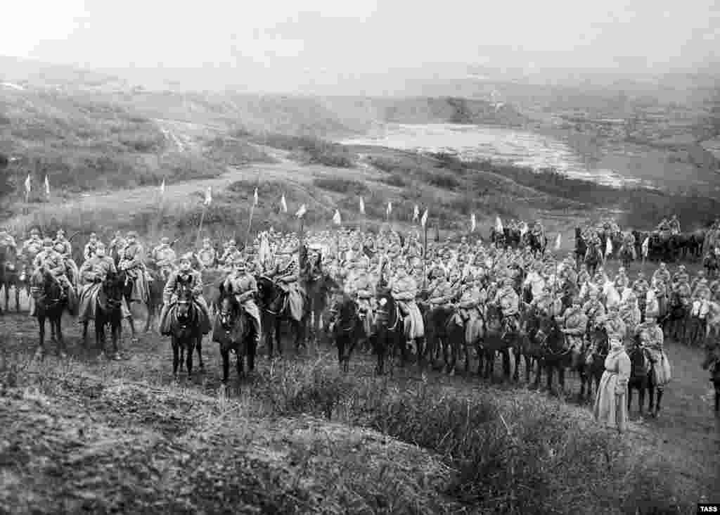 Communist Chechen cavalry in 1923. Fighters ducking bullets during Russia's civil war also complained the hat's shape made it too awkward to wear under protective helmets. 