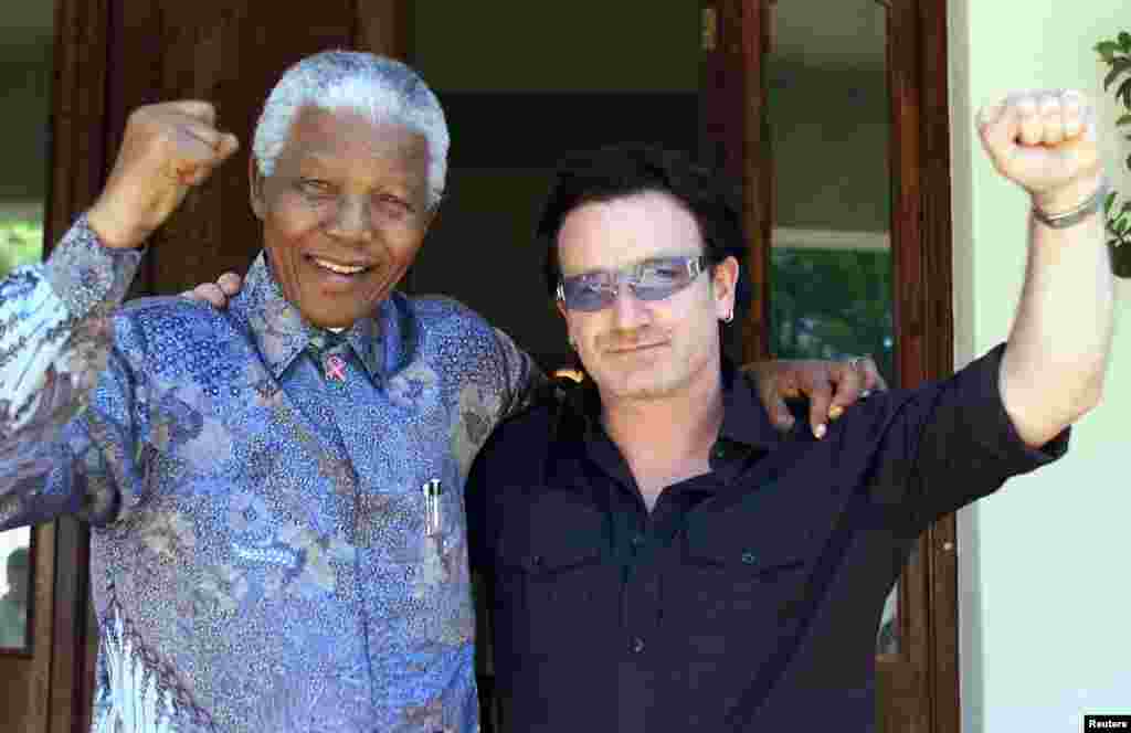 Irish rock star Bono with Nelson Mandela at the latter's residence in Johannesburg in May 2002.
