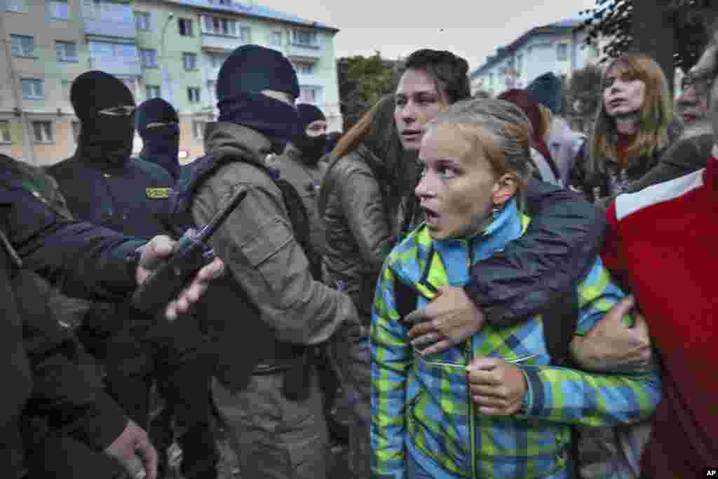 A woman shouts at police during the September 8 rally.