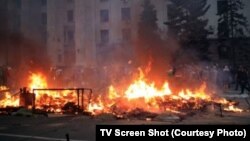 A fire burns on May 3 outside the trade union building in Odesa where dozens of pro-Russian activists died after seeking refuge amid street violence one day earlier.