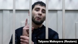 Zaur Dadayev, charged with involvement in the murder of Russian opposition figure Boris Nemtsov, speaks inside a defendants' cage in Moscow on March 8.