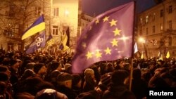 People attending a rally held by supporters of EU integration near the presidential administration building in Kyiv on December 3. 