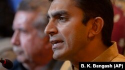 Mohsin Dawar (right), lawmaker and a leader of the Pashtun Tahafuz Movement, addresses a news conference with Afrasiab Khattak in Islamabad. (file photo)