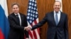 U.S. Secretary of State Antony Blinken (left) and Russian Foreign Minister Sergei Lavrov shake hands before a meeting on January 21, 2022, in Geneva. 